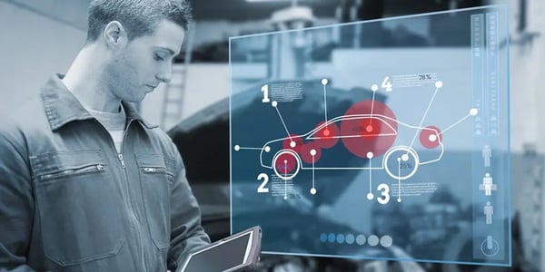 Mechanic using tablet and futuristic interface with diagram in black and white